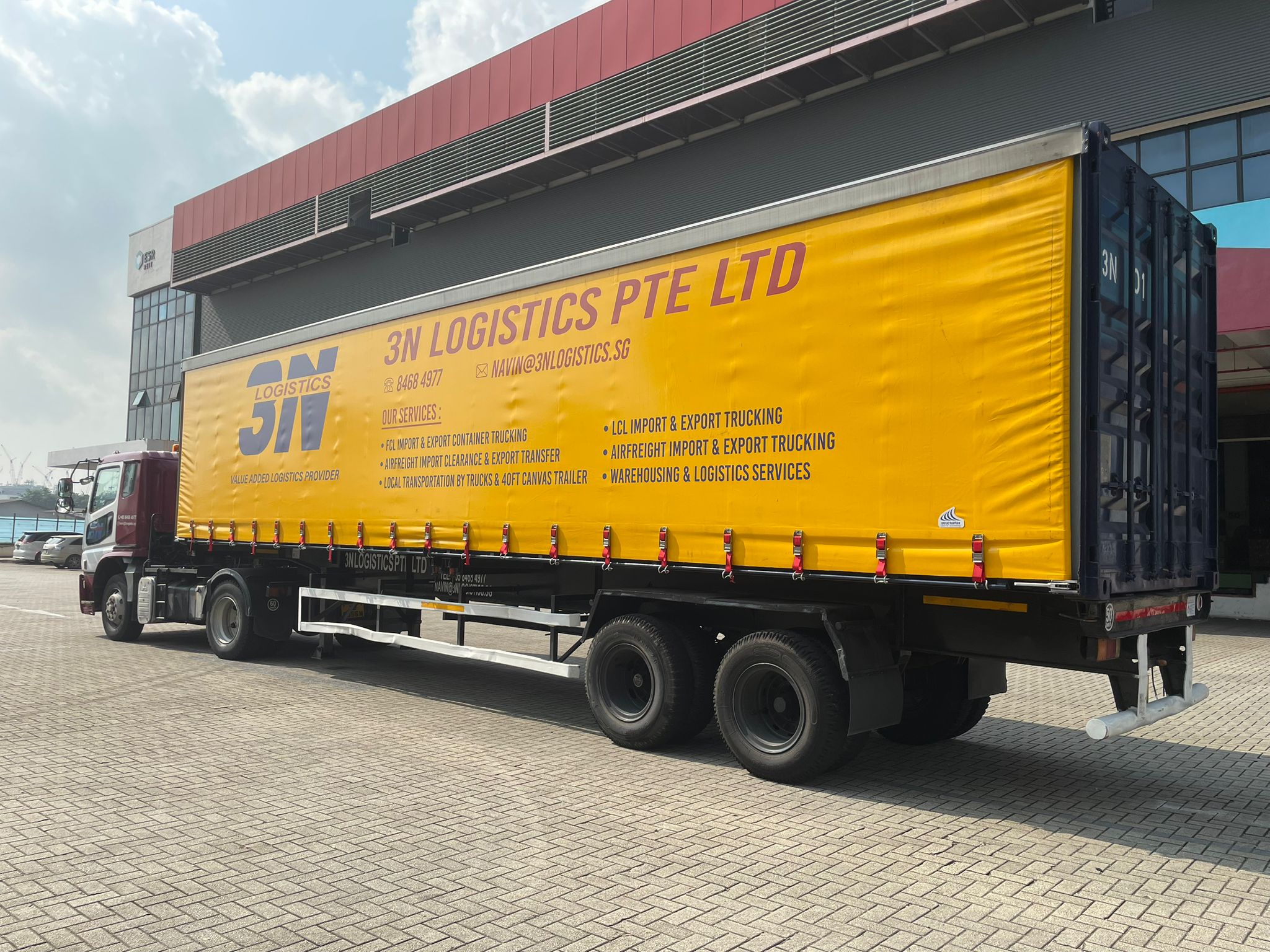 3N Logistics canvas trailer rear view at warehouse facility