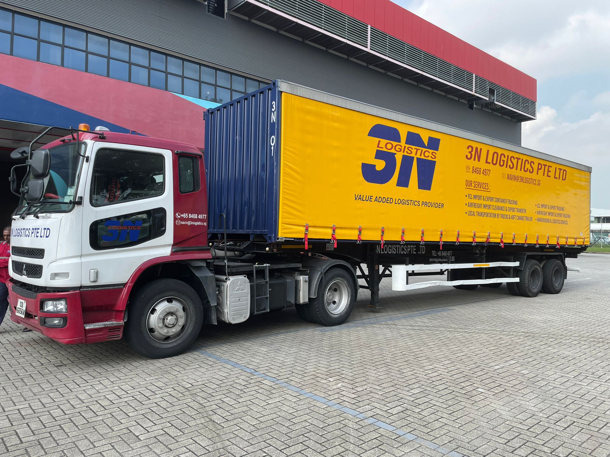 3N Logistics canvas truck parked at warehouse facility